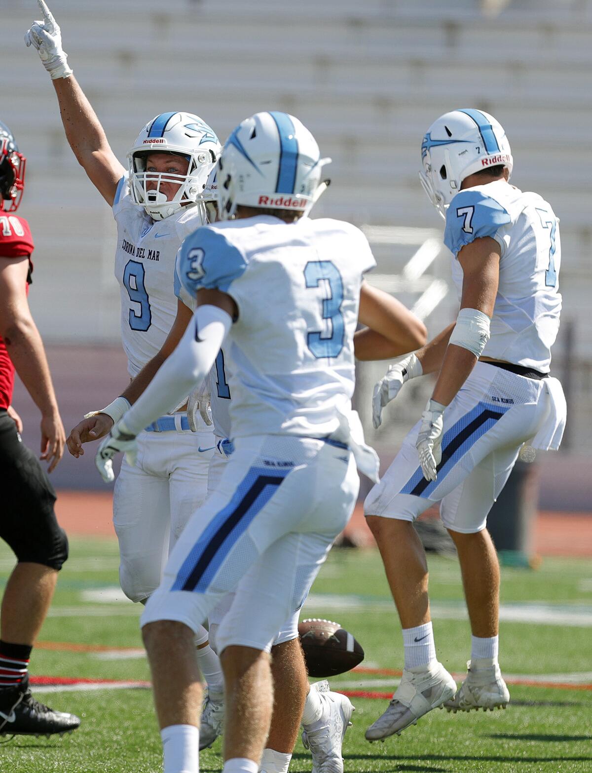 Corona del Mar's Carter Duss (9) celebrates after intercepting a pass in a nonleague game at Palos Verdes on Friday.