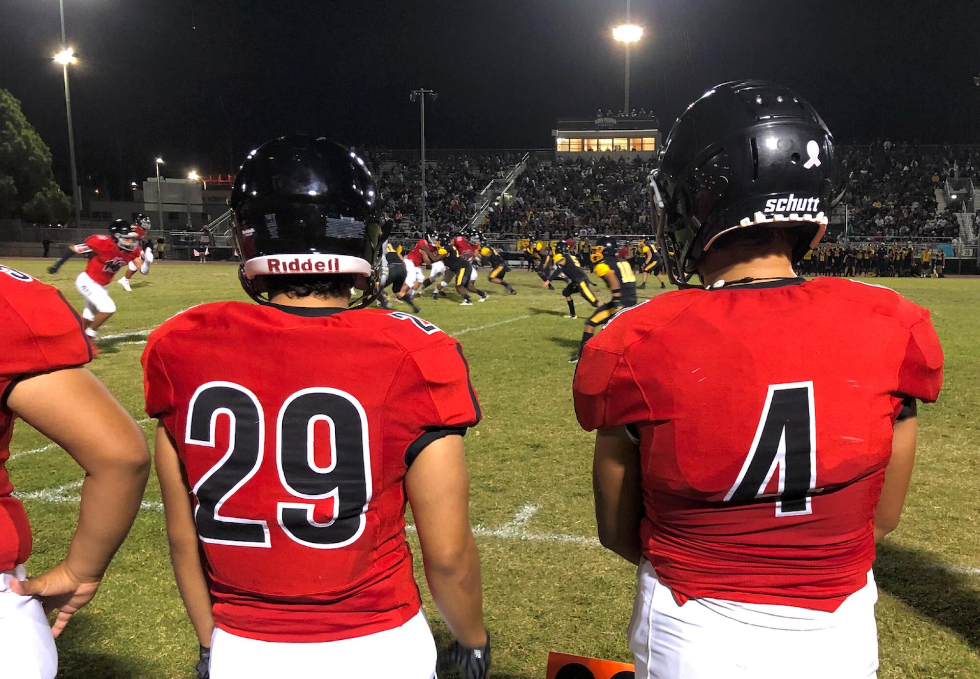 Banning players watch from side line during their annual rivalry game against San Pedro.