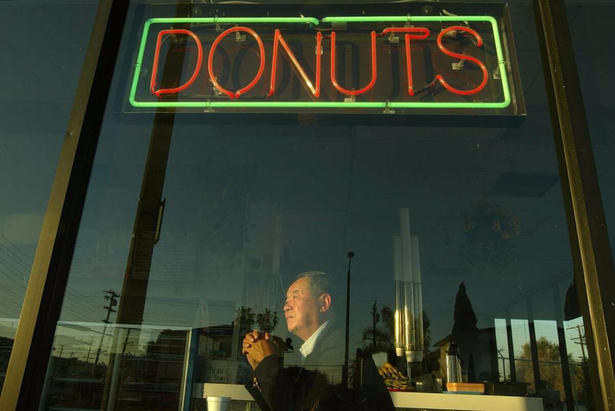 Ted Ngoy stands inside a Christy's Donut Shop in Hawthorne. Ngoy built the shop in the mid-1980s and later sold the shop. (Gary Friedman / Los Angeles Times)