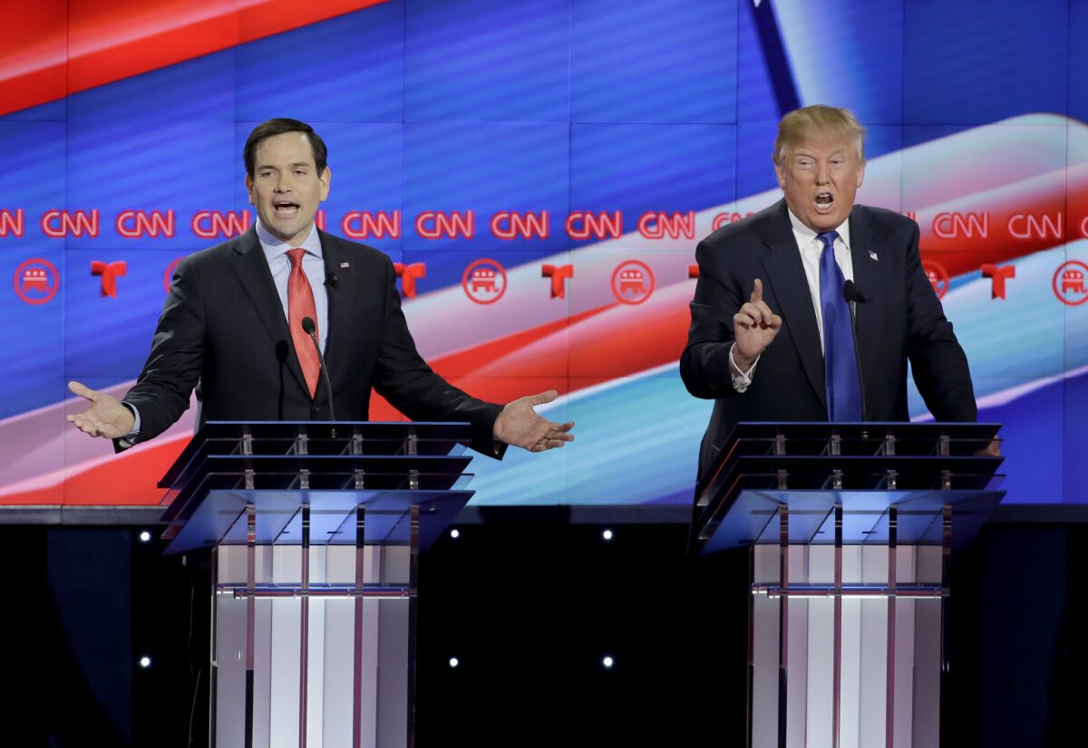 Sen. Marco Rubio, left, and Donald Trump face off during the Republican presidential debate in Houston on Thursday.