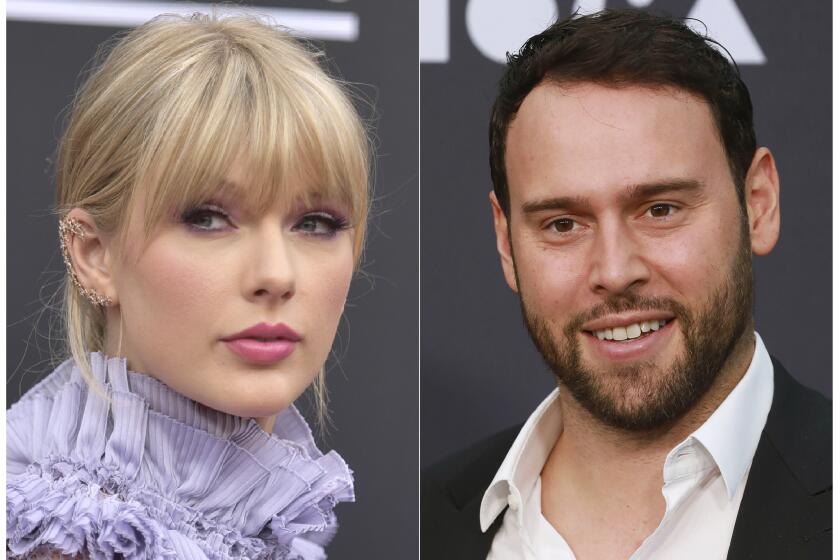 This combination photo shows Taylor Swift at the Billboard Music Awards at the MGM Grand Garden Arena in Las Vegas on May 1, 2019, left, and Scooter Braun at the 2019 MOCA benefit in Los Angeles on May 18, 2019. Brauns Ithaca Holdings acquired Big Machine Label Group, home to Swifts first six albums, including the Grammy winners for album of the year, 2008s Fearless and 2014s 1989. (Photos by Richard Shotwell, left, and Mark Von Holden/Invision/AP)