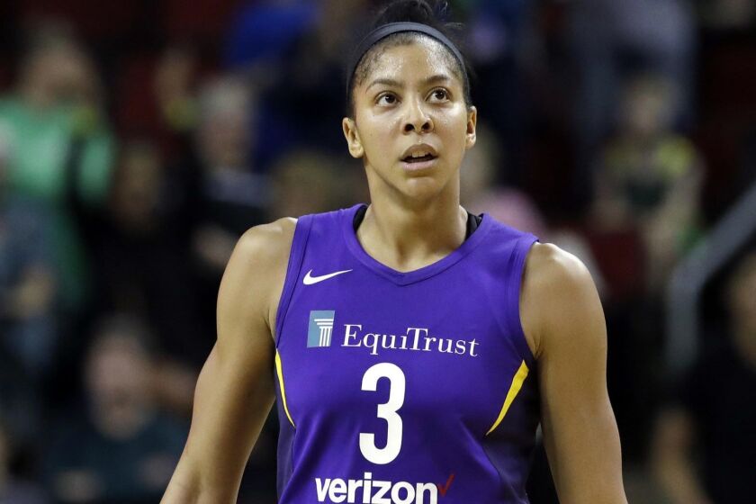 Los Angeles Sparks' Candace Parker looks on against the Seattle Storm in the second half of a WNBA basketball game Tuesday, July 10, 2018, in Seattle. (AP Photo/Elaine Thompson)