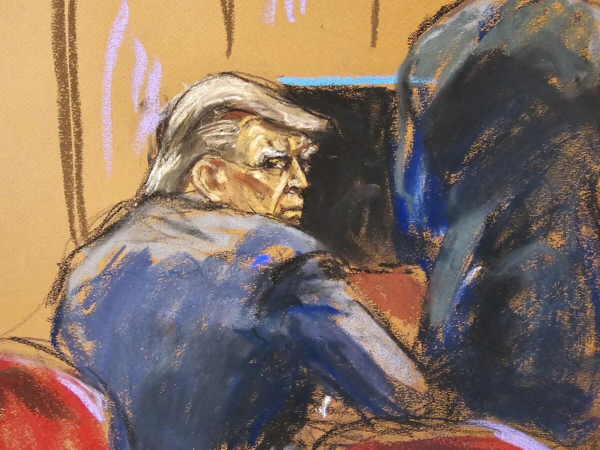 In a courtroom sketch, former President Trump looks over his shoulder in the Manhattan Criminal Courthouse.