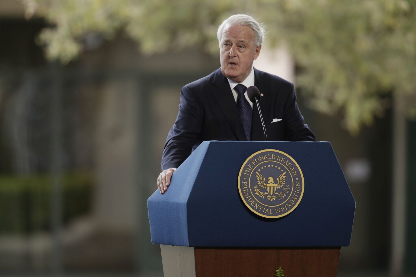 Former Canadian Prime Minister Brian Mulroney reads a letter from Ronald Reagan to Nancy Reagan during the funeral service for former First Lady Nancy Reagan.