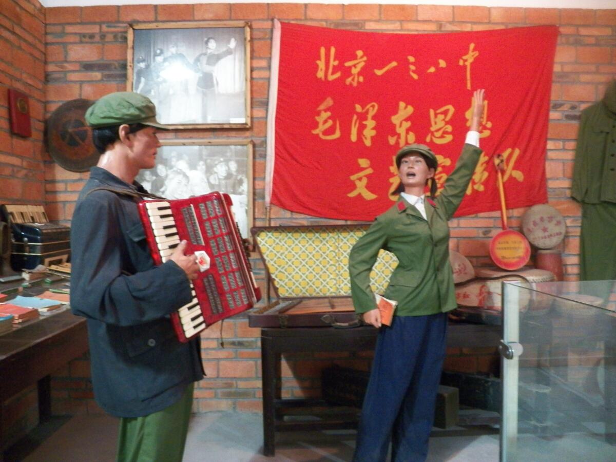 A life-size diorama shows people performing "revolutionary songs" during the Cultural Revolution of 1966-76 at the Jianchuan Museum Cluster in Anren, China. The country's media regulator has announced a new program that echoes the period.