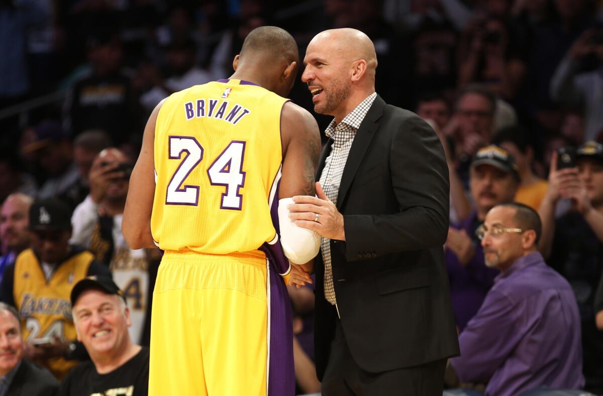 Los Angeles Lakers' Kobe Bryant, left, greets Milwaukee Bucks Coach Jason Kidd just before Tuesday's game.