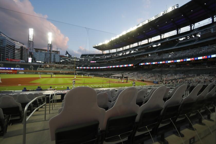 Atlanta Braves play the New York Mets with no fans in attendance at Truist Park during a baseball game Saturday, Aug. 1, 2020, in Atlanta. (AP Photo/John Bazemore)