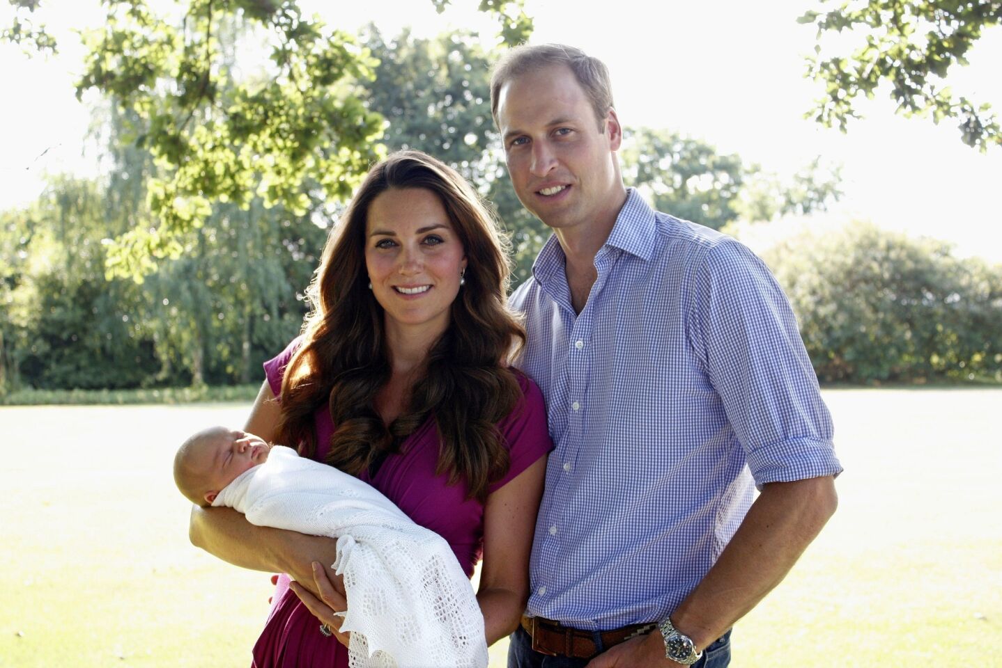 Prince William, Duke of Cambridge, and his wife, Catherine, Duchess of Cambridge, pose with their newborn baby boy, Prince George of Cambridge, at the Middleton family home in Bucklebury, Berkshire.