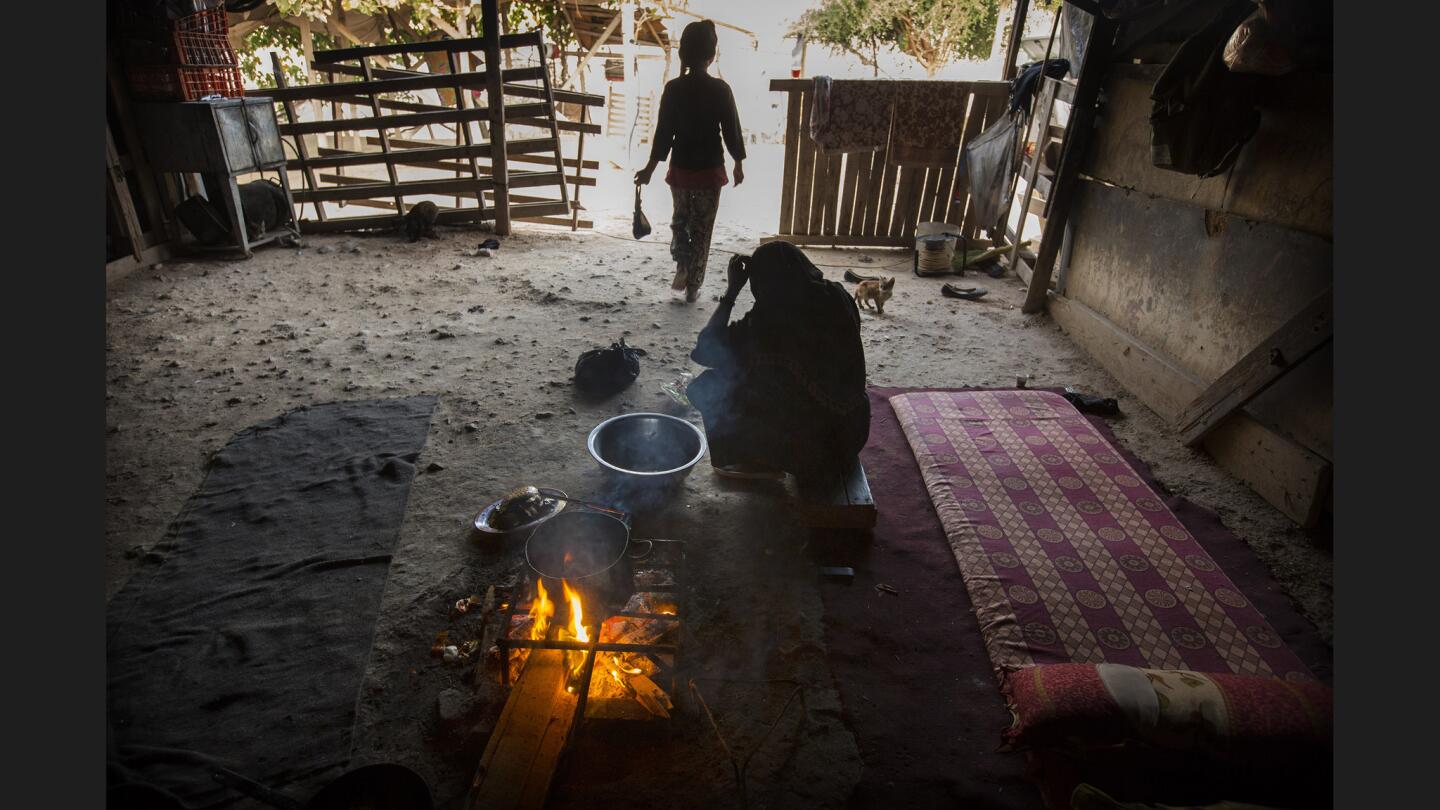 Nasrin, 12, loves what functions as a kitchen for her family, including her mother, Sara.