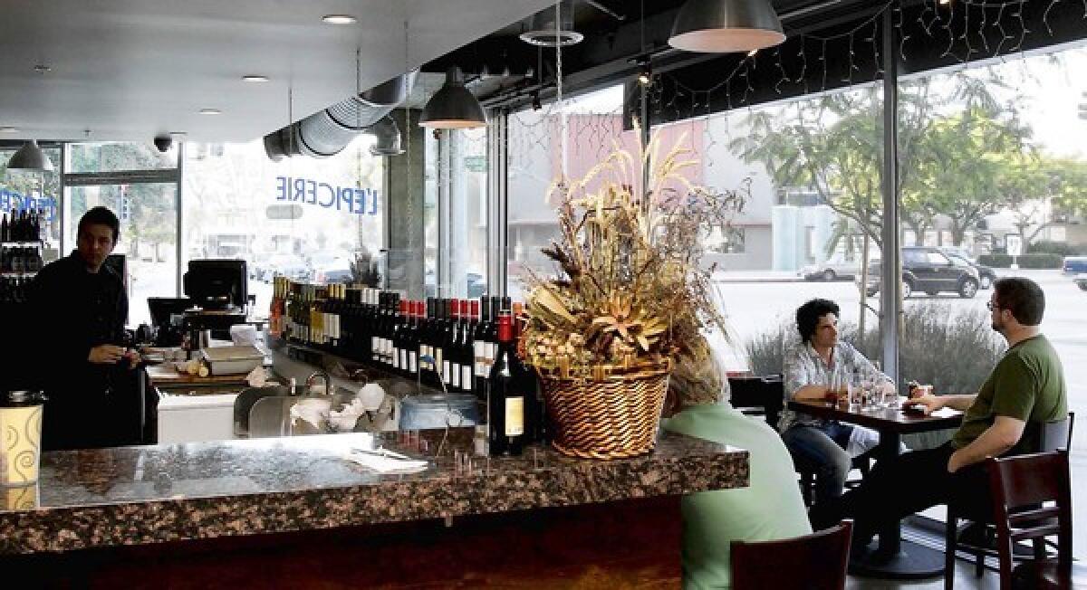 [L'Epicerie Market in Culver City is a bar, a dining room, a bakery and a takeout place.