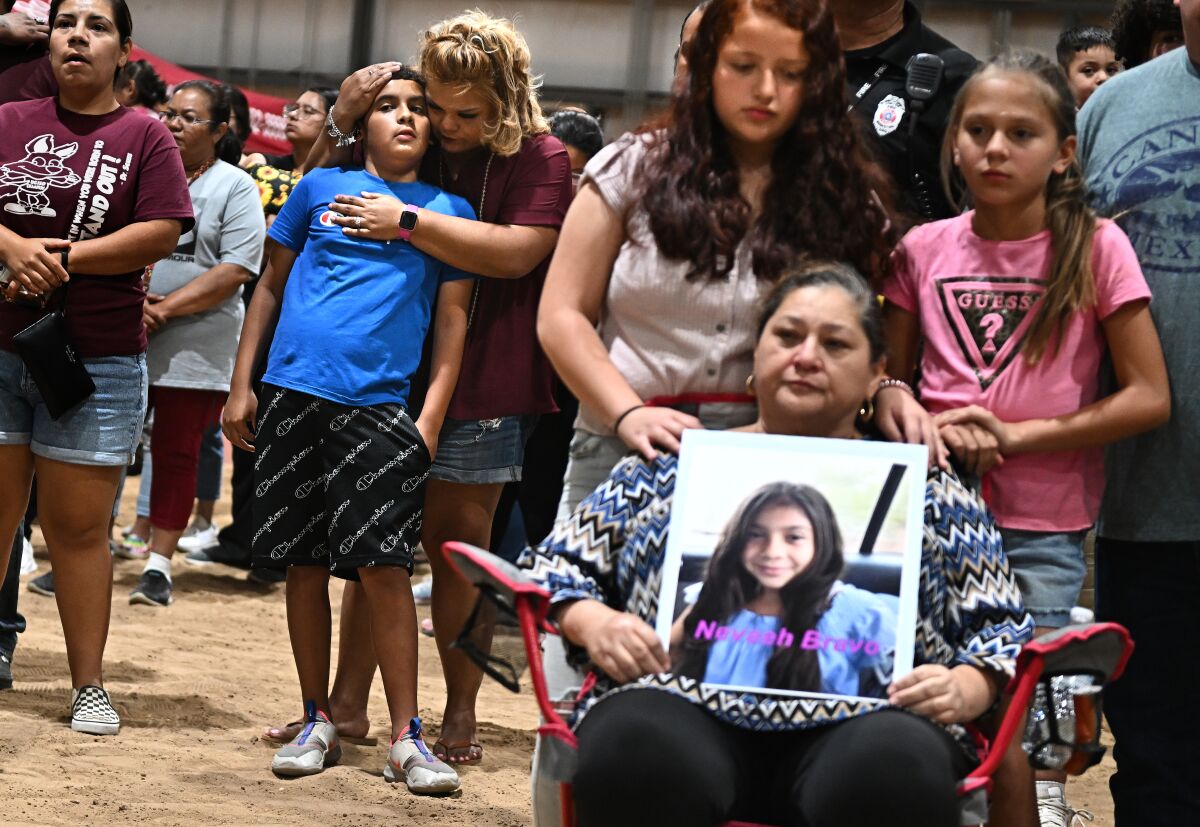 Families gather during a vigil at the Uvalde County Fairplex.