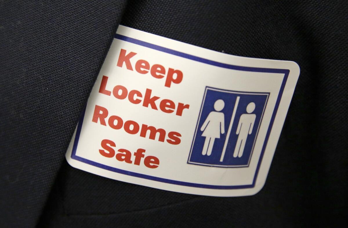 A sticker that reads "Keep Locker Rooms Safe" was worn by people in Washington when that state adopted a new rule allowing transgender people to use gender-segregated bathrooms and locker rooms in public buildings.