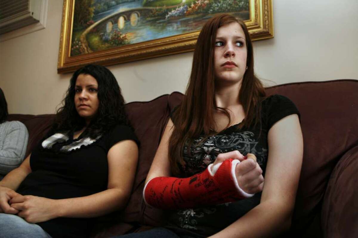 In 2008, Alicia Sgro, right, then 14, and Jennifer Jones were at a Long Island Wal-Mart where an employee was killed in a crowd stampede. Sgro was injured beforehand. An angry woman in the crowd attacked her, she said, fracturing her arm and injuring her nose.