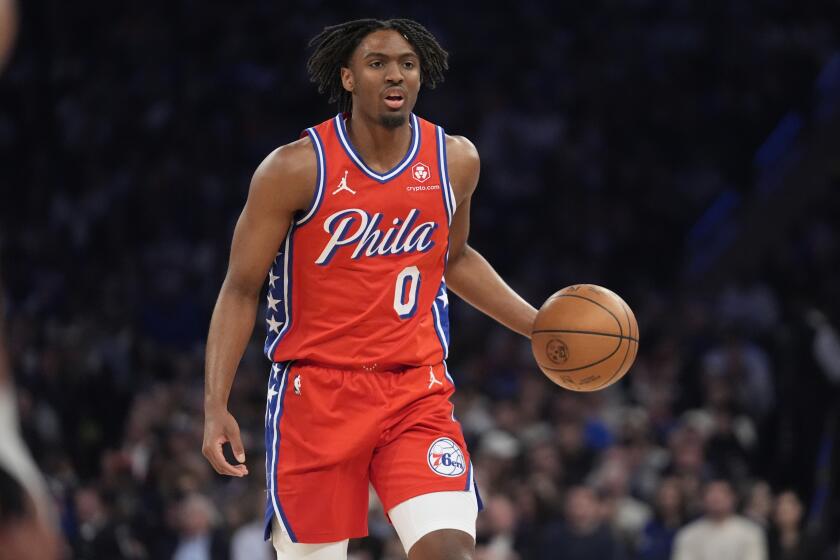 Philadelphia 76ers' Tyrese Maxey (0) looks to pass during the first half of Game 2 in an NBA basketball first-round playoff series against the New York Knicks Monday, April 22, 2024, in New York. (AP Photo/Frank Franklin II)
