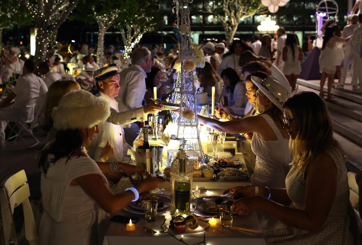Guests enjoys their meals at Diner en Blanc 2016 in downtown L.A.