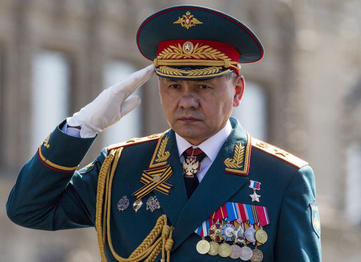 Russian Defense Minister Sergei Shoigu salutes his soldiers in May as he is driven along Red Square during a rehearsal for a Victory Day parade.