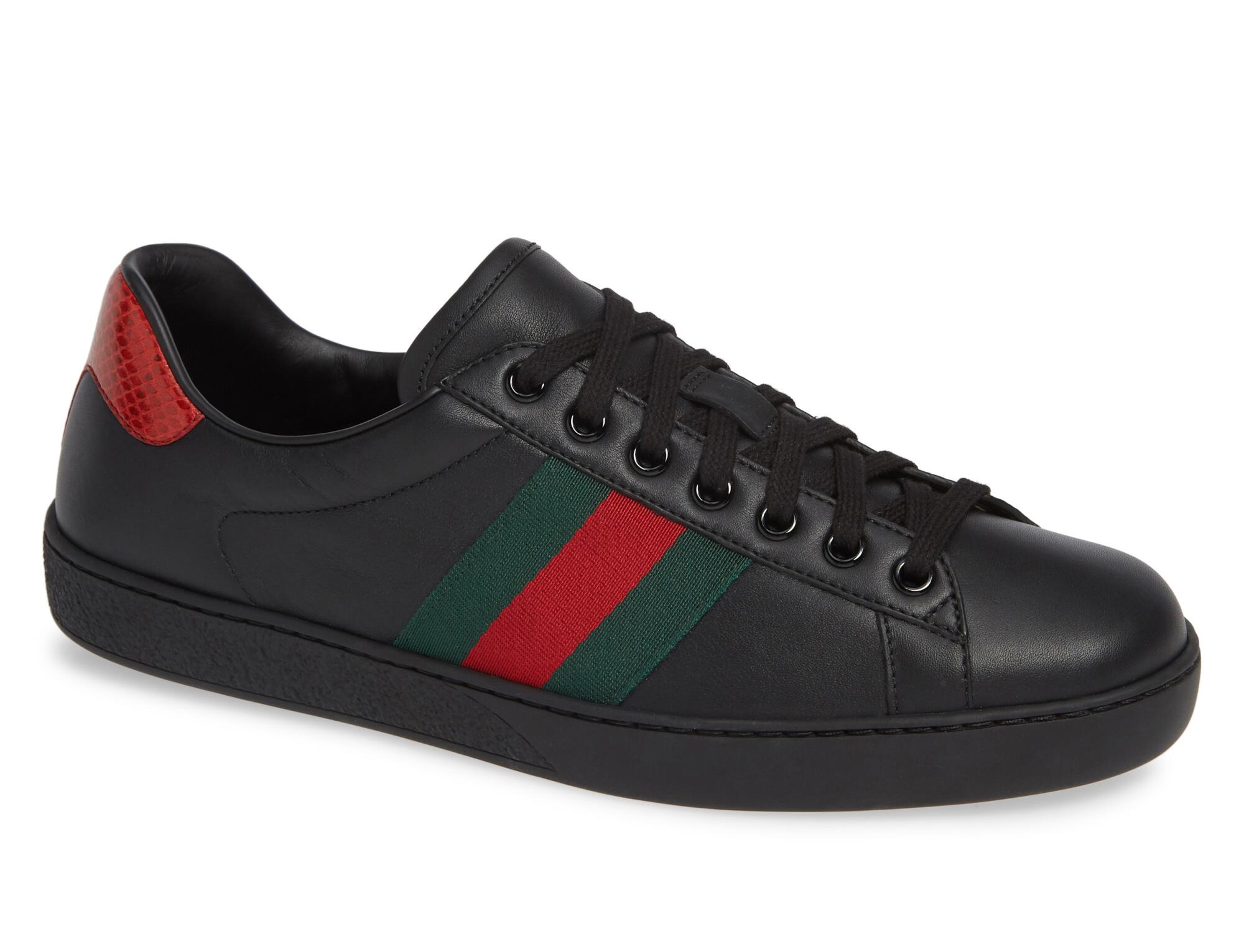 A black Gucci striped sneaker.