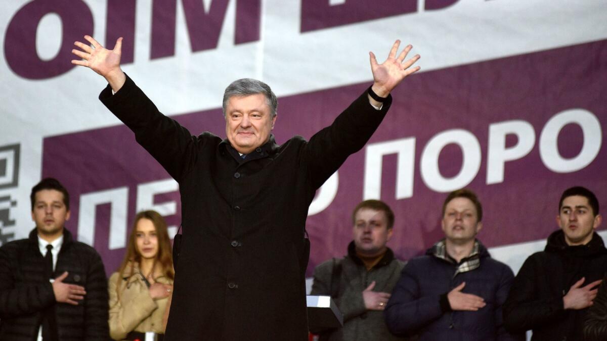 Ukrainian President Petro Poroshenko greets supporters during a campaign rally in the western city of Lviv on March 28, 2019.