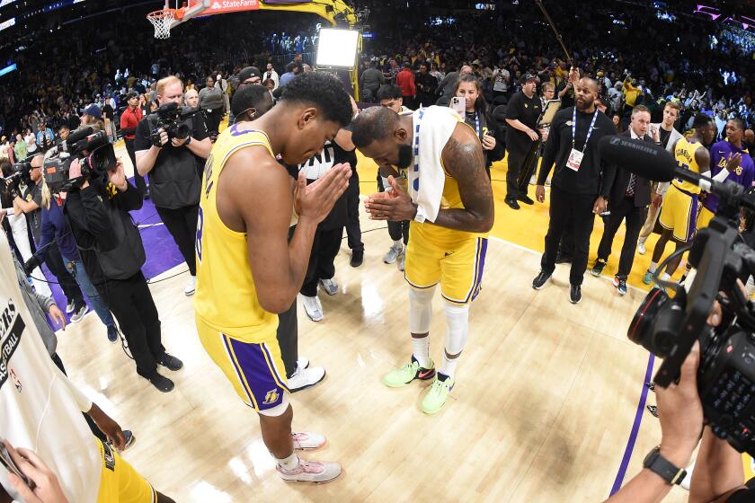 LOS ANGELES, CA - APRIL 24: Rui Hachimura #28 and LeBron James #6 of the Los Angeles Lakers after Round One Game Four of the 2023 NBA Playoffs against the Memphis Grizzlies on April 24, 2023 at Crypto.Com Arena in Los Angeles, California. NOTE TO USER: User expressly acknowledges and agrees that, by downloading and/or using this Photograph, user is consenting to the terms and conditions of the Getty Images License Agreement. Mandatory Copyright Notice: Copyright 2023 NBAE (Photo by Andrew D. Bernstein/NBAE via Getty Images)