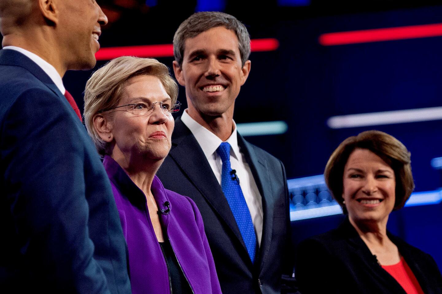 Cory Booker, Elizabeth Warren, Beto O'Rourke and Amy Klobuchar, from left, on the debate stage in Miami.