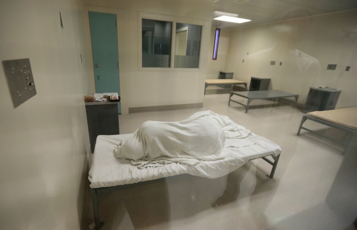 An inmate sleeps in a room in an area of the Twin Towers Correctional Facility in downtown Los Angeles meant for psychiatric and medical care. 