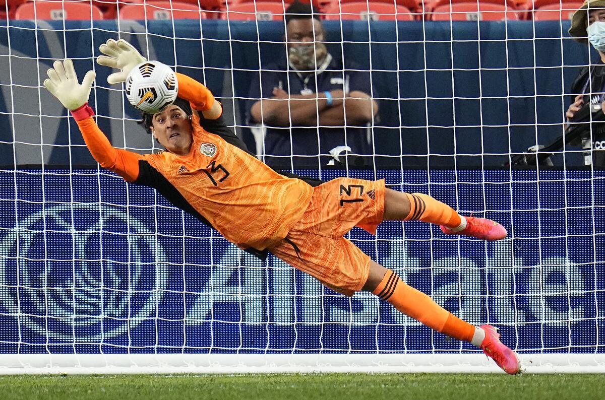 Mexico's Guillermo Ochoa makes a save 