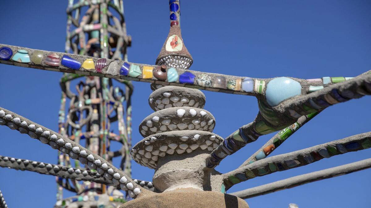 Shells share real estate with pieces of broken pottery in this section of the Watts Towers.