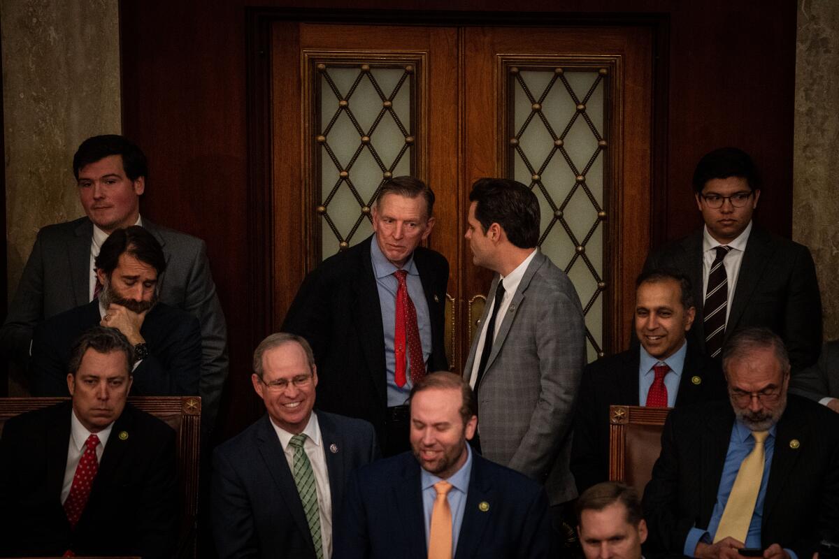 Reps. Paul Gosar (R-Ariz.) and Matt Gaetz (R-Fla.) on the House floor during a speaker vote on Jan. 6. 