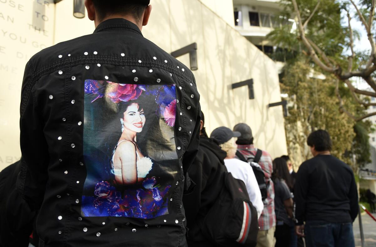Fans of the late singer Selena Quintanilla wait in line