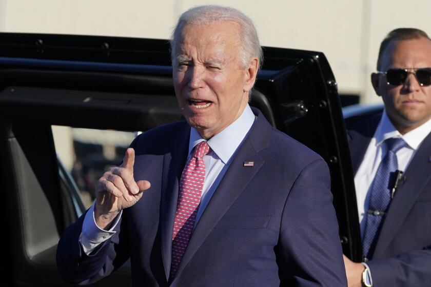 President Joe Biden responds to members of the media after arriving in Norfolk, Va., Sunday, Nov. 19, 2023. President Biden is visiting naval installations in Virginia on Sunday to kick off the holiday week by hosting a screening of the movie "Wonka" and having a "friendsgiving" meal with service members and their relatives. (AP Photo/Manuel Balce Ceneta)