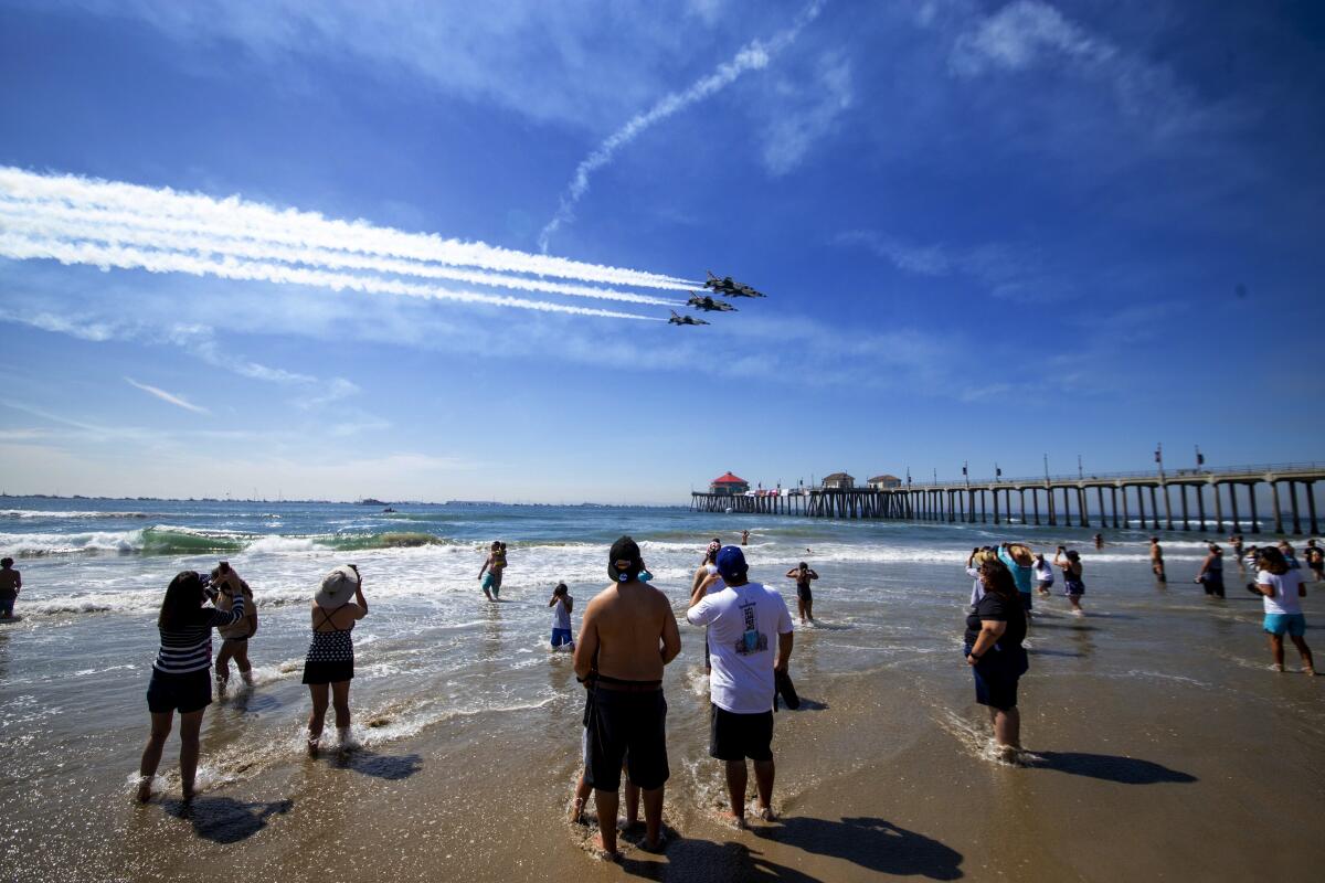 The U.S. Air Force Thunderbirds do a fly past Huntington Beach Pier during last year's Pacific Airshow.
