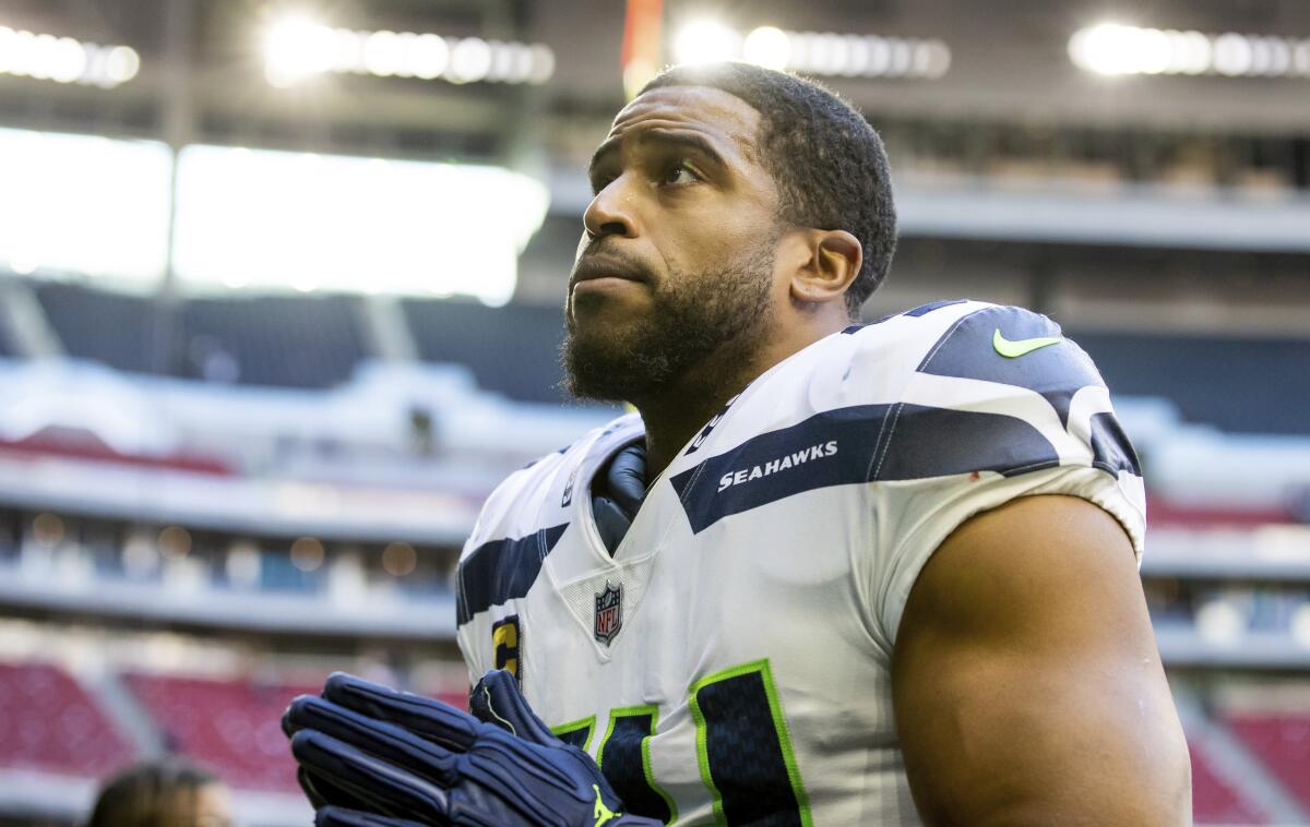 Seattle Seahawks linebacker Bobby Wagner walks off the field after defeating the Texans in Houston.