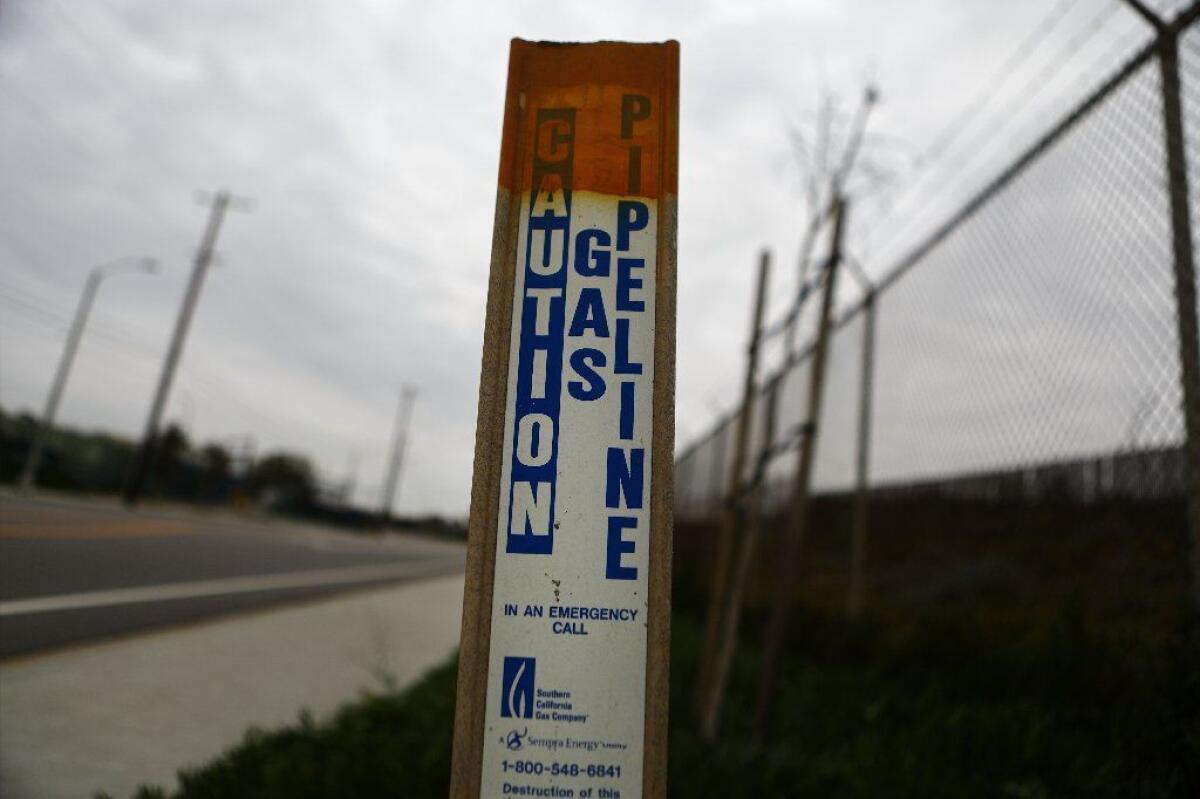 A warning sign marks a Southern California Gas Co. pipeline outside Scattergood Generating Station, a natural gas-fired power plant near El Segundo.