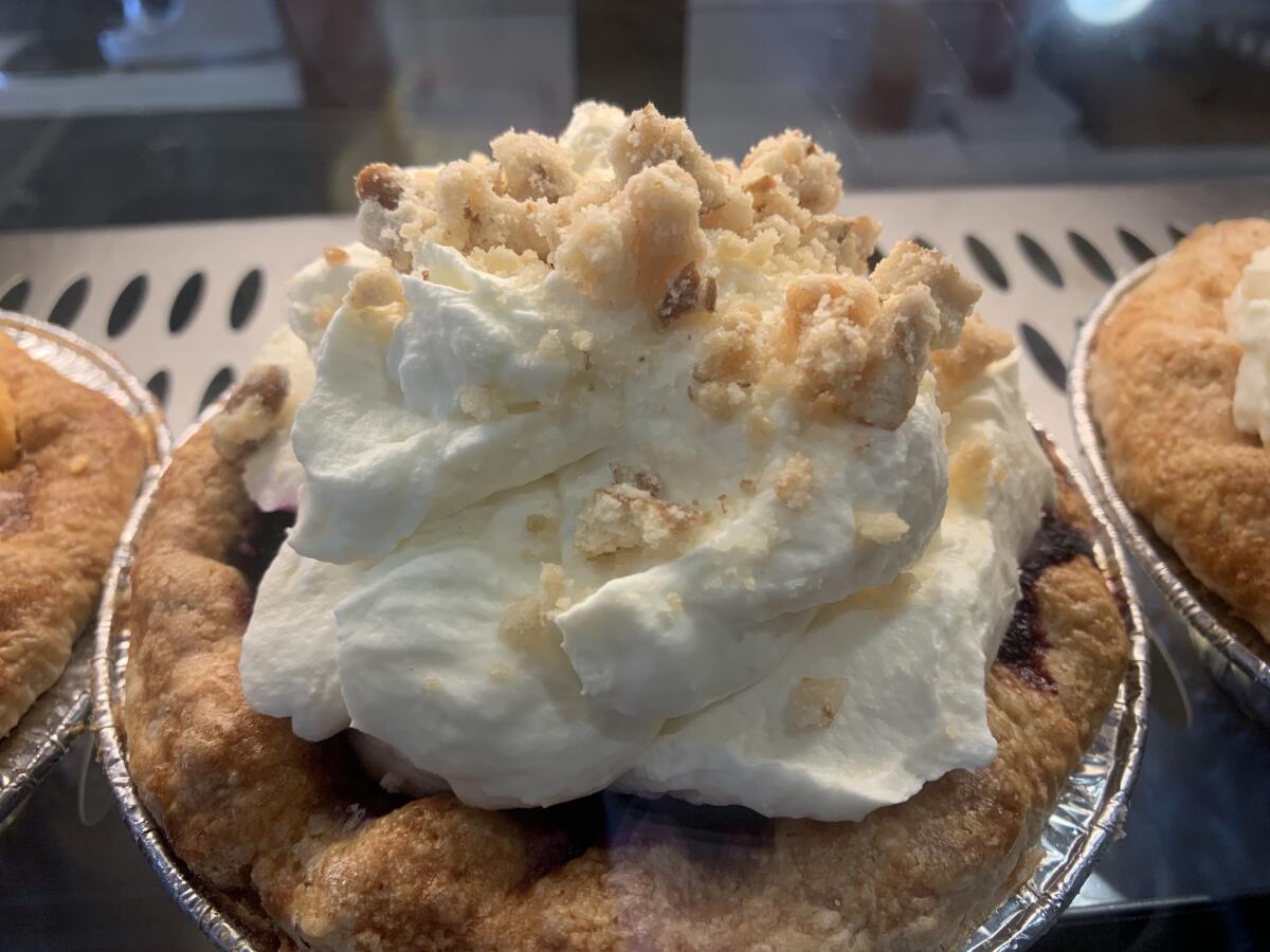 The peanut butter banana pie with blueberry compote, topped with pretzel streusel, at Toast Kitchen & Bakery in Costa Mesa.