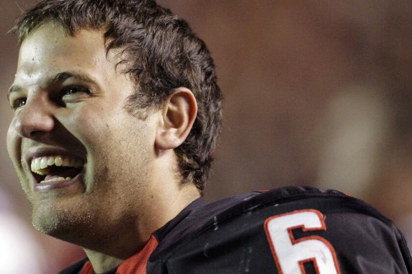 Texas Tech quarterback Graham Harrell smiles from the sidelines during the fourth quarter of an NCAA college football game against Oklahoma State, Saturday, Nov. 8, 2008, in Lubbock, Texas. Texas Tech won 56-20. (AP Photo/Matt Slocum) ORG XMIT: TXMS113