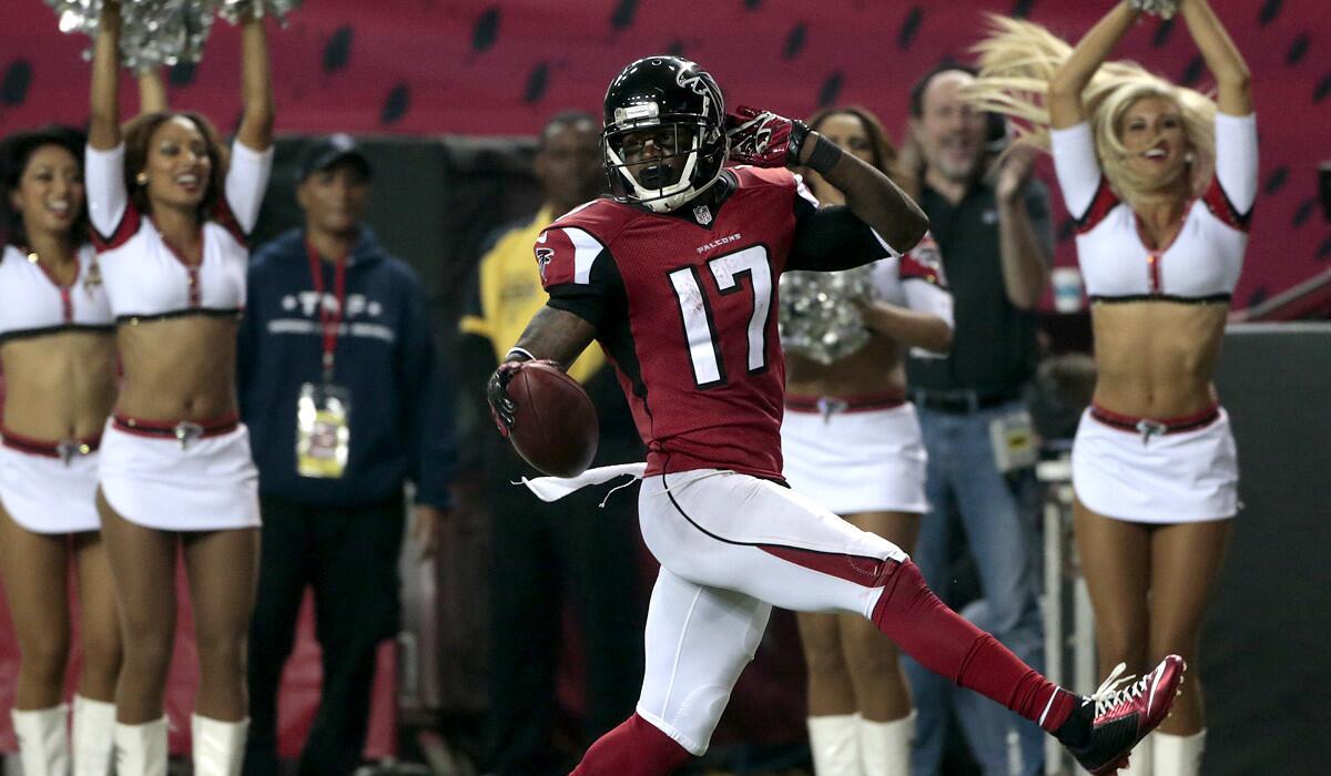 Falcons receiver Devin Hester (17) finishes off a punt return for a touchdown against the Buccaneers in the first half Thursday night in Atlanta.