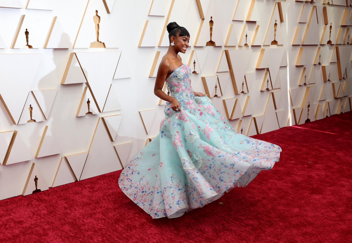 Saniyya Sidney arriving at the 94th Academy Awards red carpet in a colorful gown.