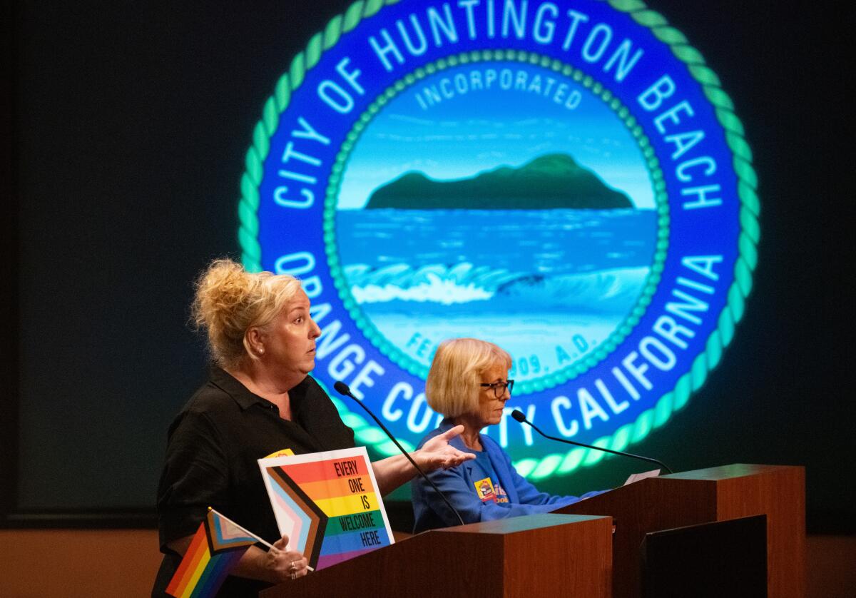 Resident Wendy Rincon, left, addresses the Huntington Beach City Council during Tuesday night's meeting.