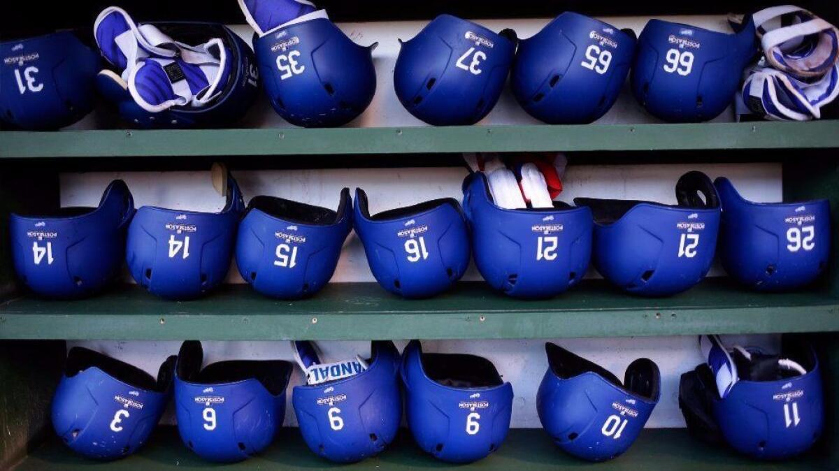 Dodger blue batting helmets are lined up during the National League Championship Series at Chicago's Wrigley Field on Oct. 17.