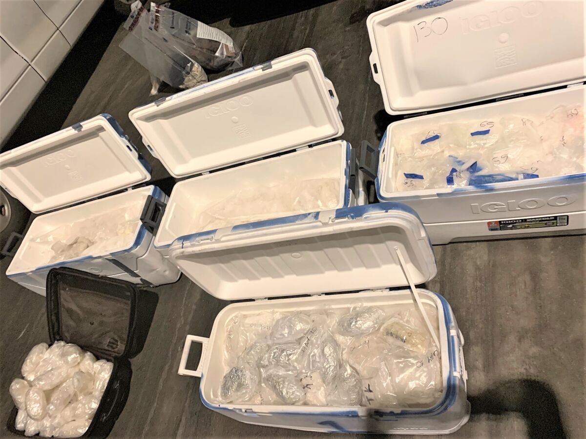 Four ice chests full of packages of meth