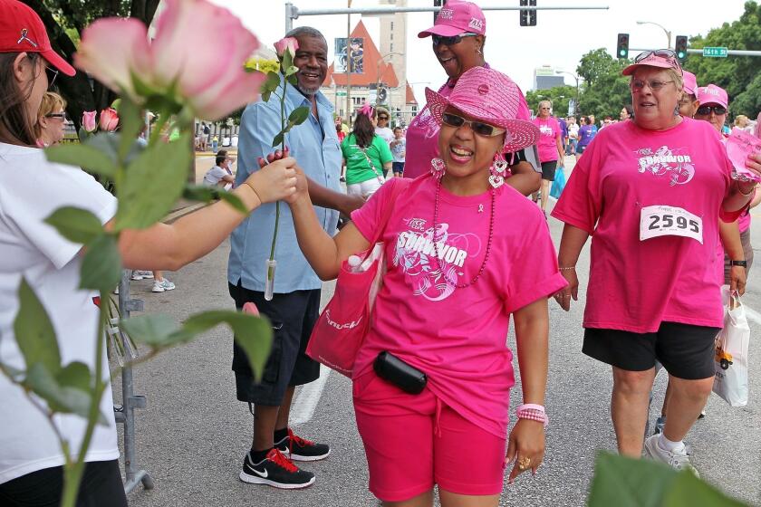 Breast cancer survivor Jacqueline Spears-Williams smiles at the finish of the 15th Annual Susan G. Komen St. Louis Race for the Cure in June. A new study finds that black women tend to be sicker than white women at the time of their diagnosis.