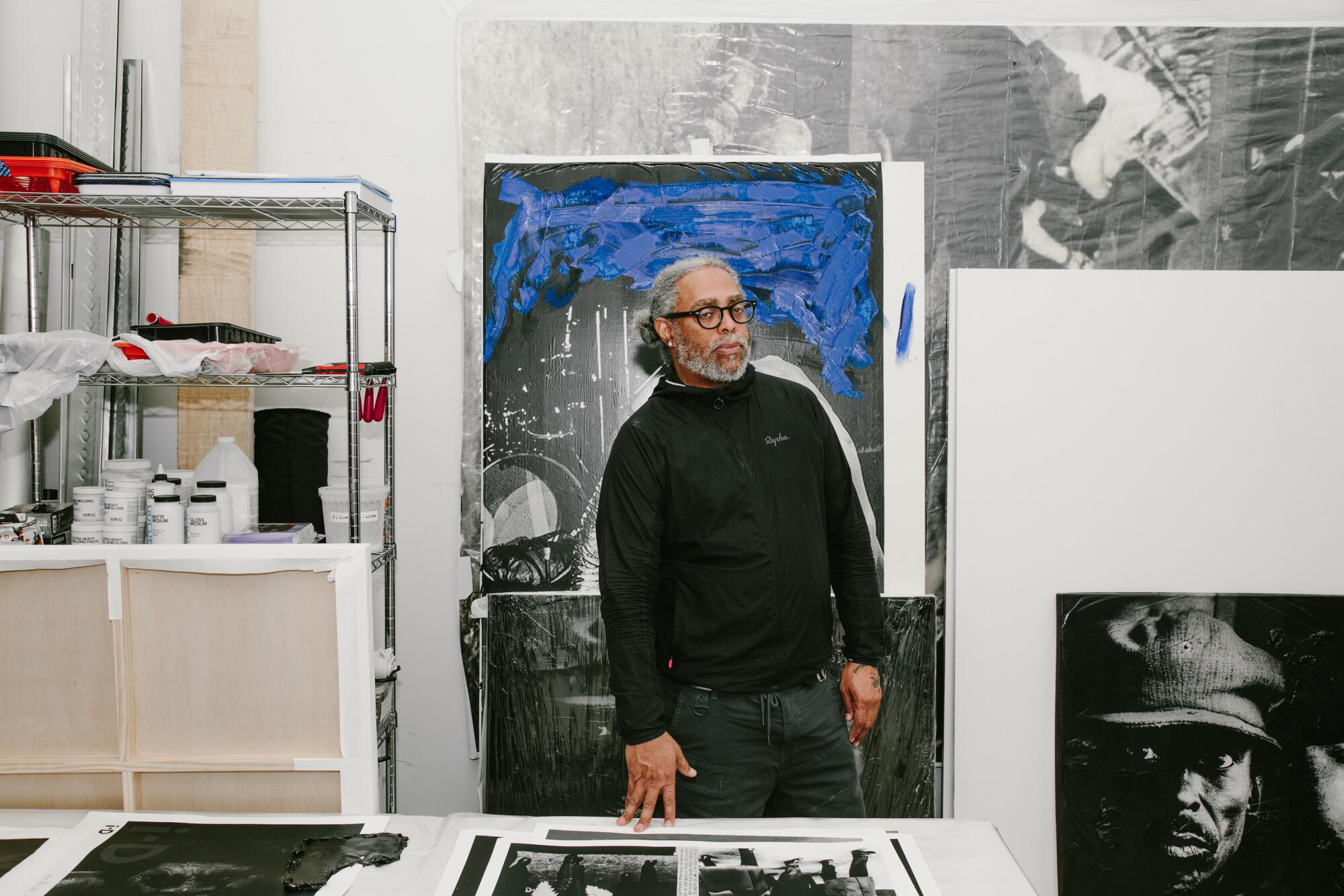 Arthur Jafa in front of his paintings.