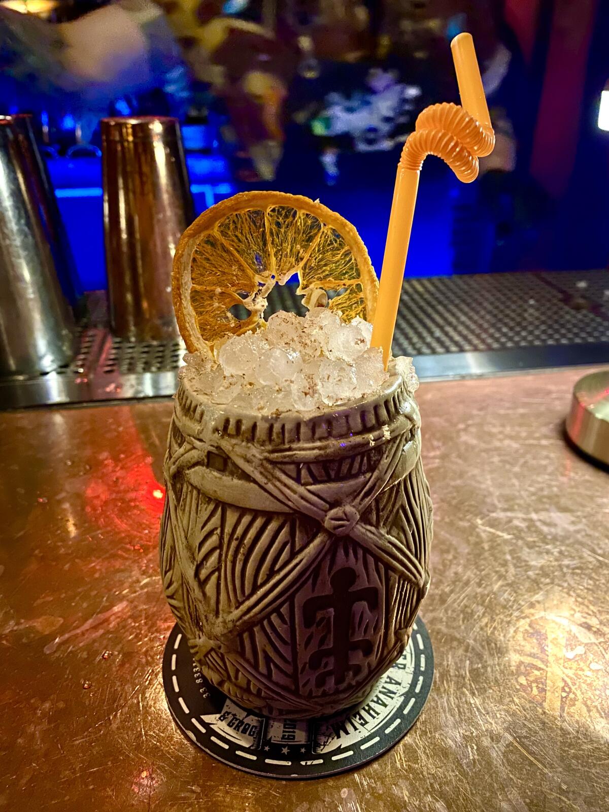 A cocktail in a tiki mug.