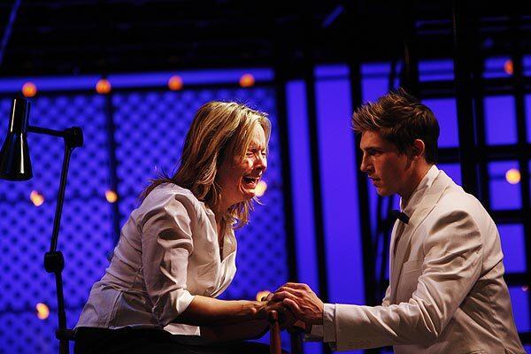 Alice Ripley, as Diana, performs in an emotional scene with Curt Hansen, cast as Diana's son, in "Next to Normal," the Pulitzer-winning musical at the Ahmanson Theatre in Los Angeles.