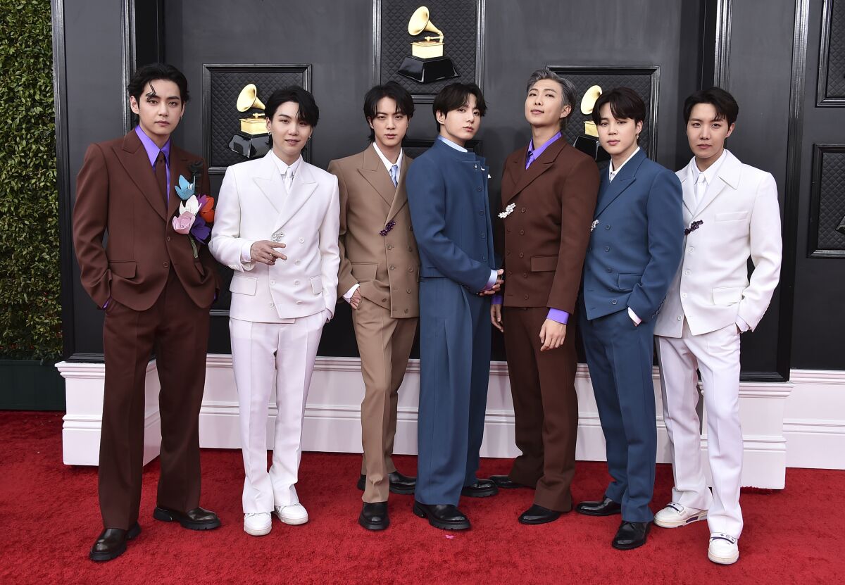 FILE - BTS arrives at the 64th Annual Grammy Awards on April 3, 2022, in Las Vegas. The group says they are taking time to focus on solo projects. The seven-member group with hits like “Butter” and “Dynamite” talked about their future in a video posted June 14, celebrating the nine year anniversary of their debut release. (Photo by Jordan Strauss/Invision/AP, File)