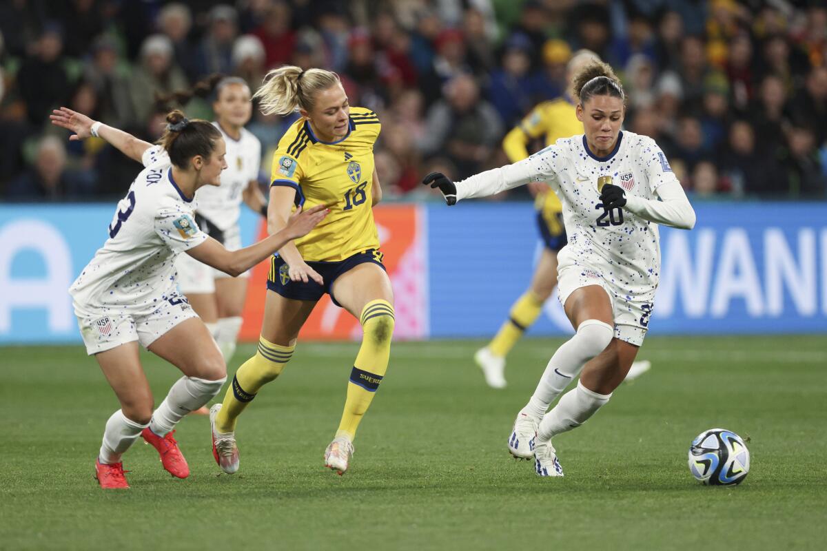 Emily Fox, Fridolina Rolfo and Trinity Rodman compete for the ball during the World Cup. 