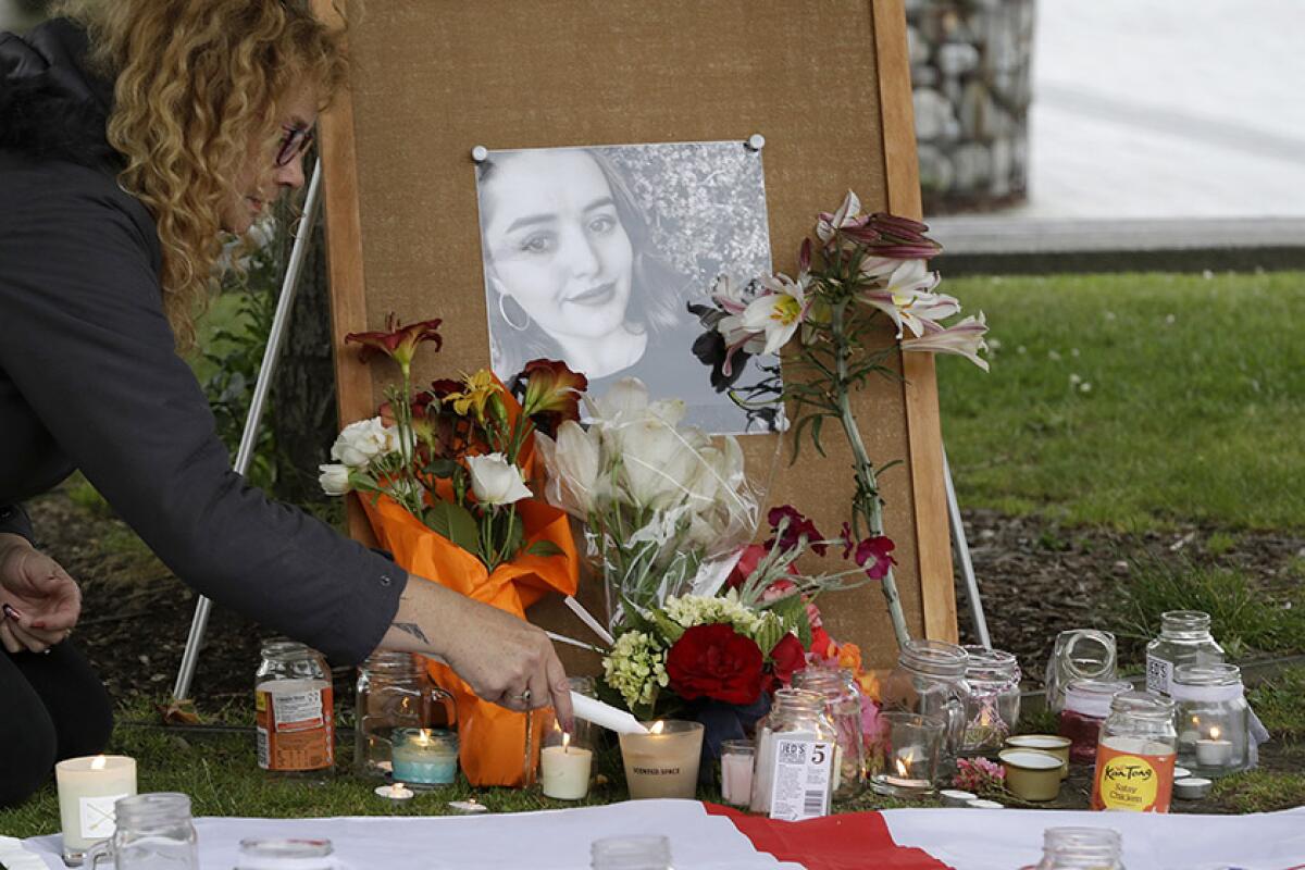A photo of Grace Millane is displayed at a makeshift memorial for the slain British tourist in Christchurch, New Zealand, in 2018.