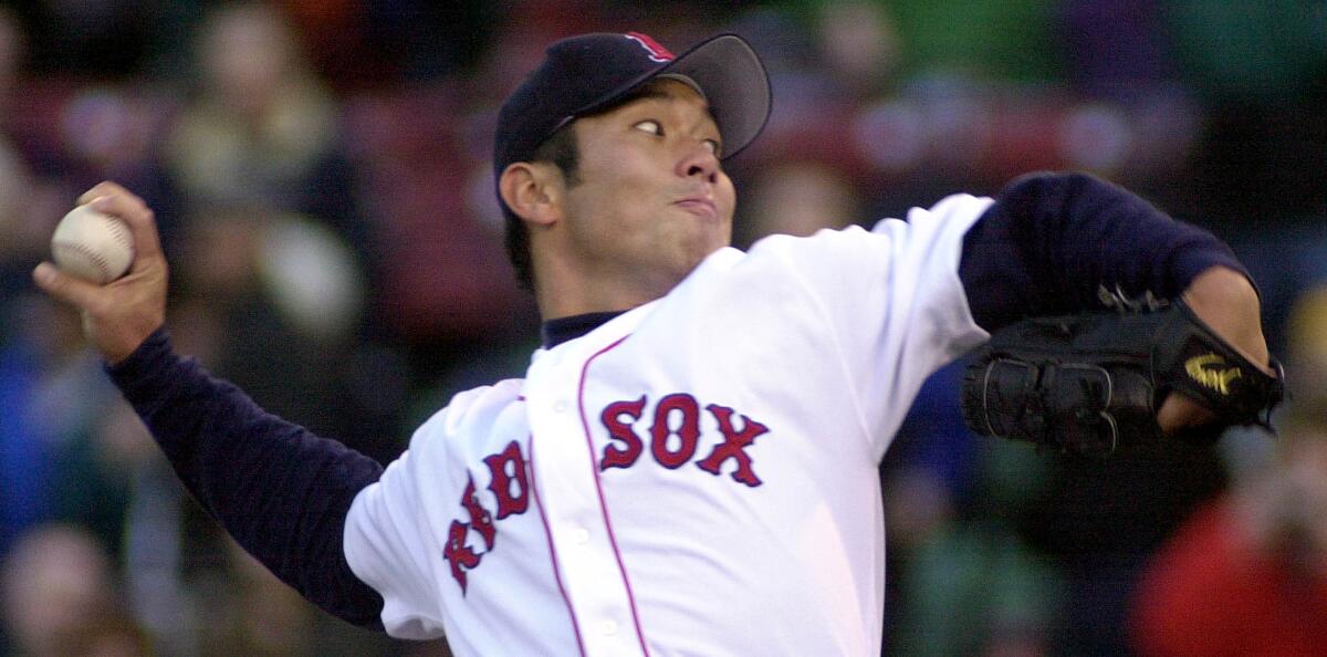 Hideo Nomo of the Boston Red Sox gets ready to deliver a pitch in 2001.