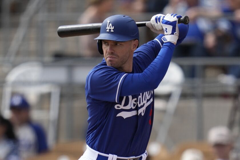 Los Angeles Dodgers' Freddie Freeman (5) waits for a pitch during a spring training baseball game against the San Diego Padres in Glendale, Ariz., Monday, March 6, 2023. (AP Photo/Ashley Landis)