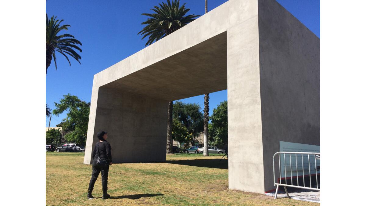 Teresa Margolles stands before the concrete monument she has erected in Echo Park.